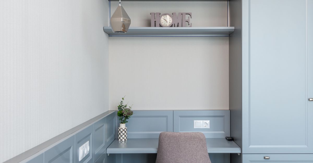 Elegant minimalist home workstation with gray furniture and decor for a stylish interior design.